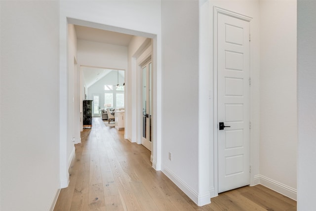 corridor with light wood-type flooring