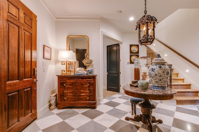 interior space with a notable chandelier and ornamental molding