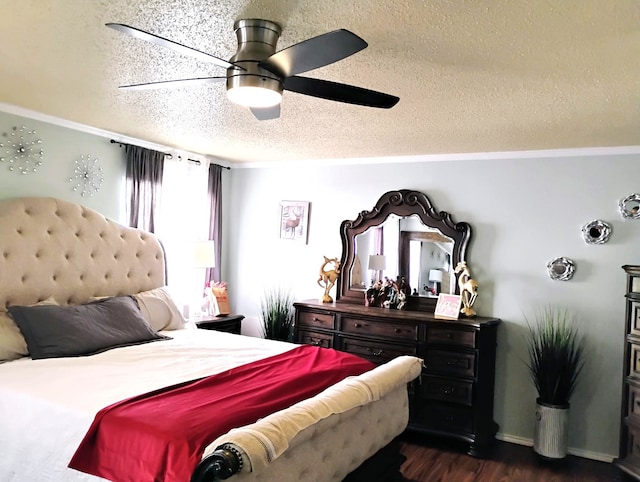 bedroom featuring ceiling fan, dark hardwood / wood-style floors, and a textured ceiling