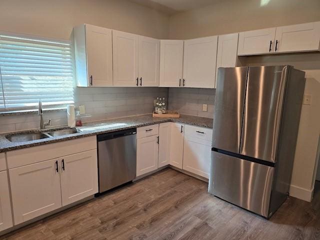 kitchen with sink, stainless steel appliances, and white cabinets