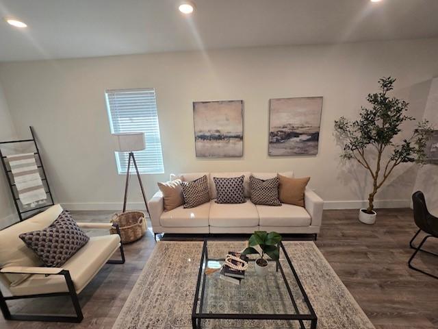 living room featuring dark hardwood / wood-style floors