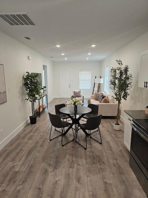 dining area with wood-type flooring