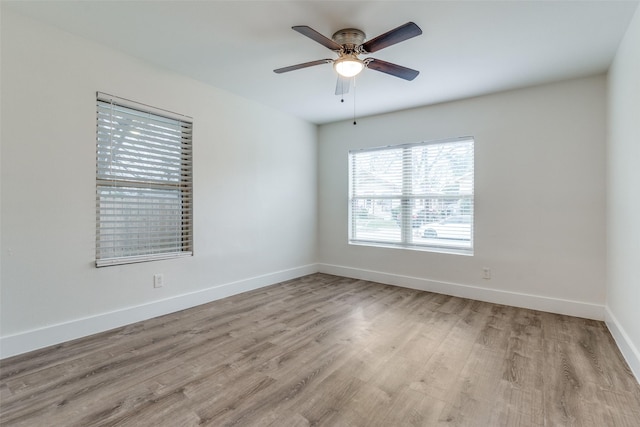 spare room with ceiling fan and light hardwood / wood-style floors