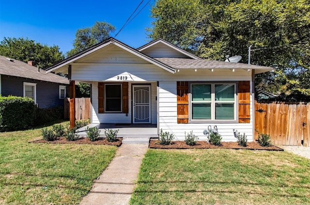 bungalow featuring a front lawn and covered porch