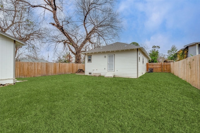 rear view of property featuring a yard