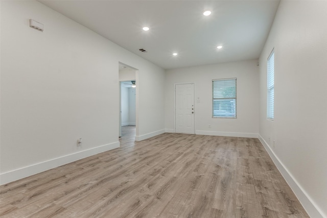 spare room featuring light hardwood / wood-style floors