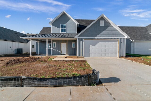 view of front of property with a porch and a garage