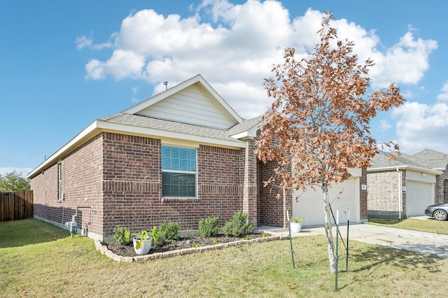 view of front facade with driveway, fence, an attached garage, a front yard, and brick siding