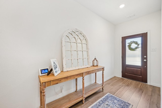 foyer entrance featuring recessed lighting, visible vents, baseboards, and light wood-style floors