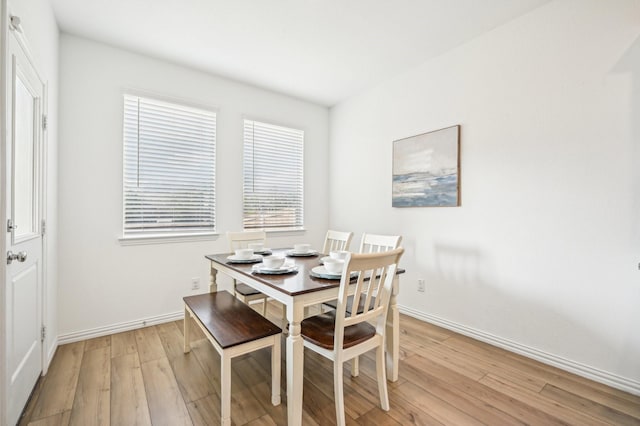 dining space with light wood-type flooring