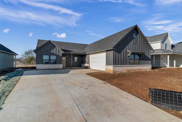 modern farmhouse featuring a garage