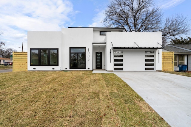 contemporary house with a front lawn and a garage