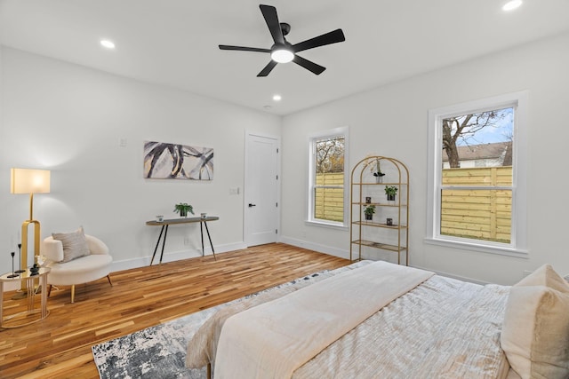 bedroom with ceiling fan and wood-type flooring