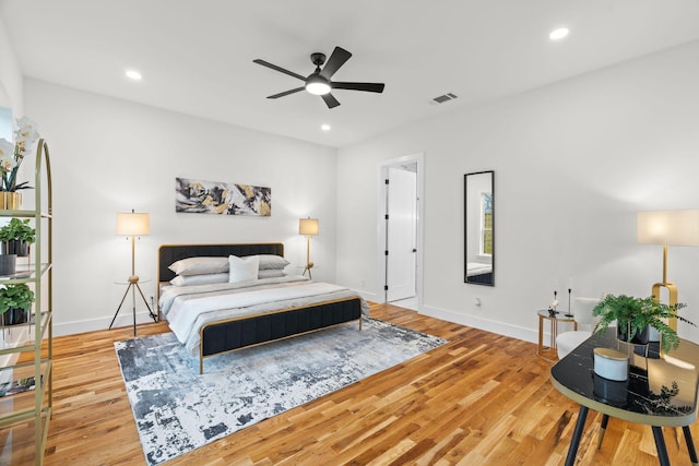 bedroom featuring light wood-type flooring and ceiling fan