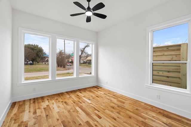 empty room featuring light hardwood / wood-style flooring and ceiling fan