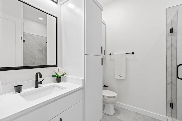 bathroom with tile patterned floors, vanity, toilet, and a shower with shower door