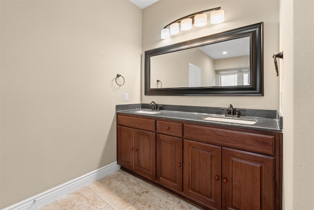 bathroom with tile patterned flooring and vanity