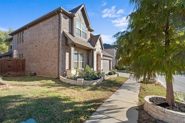 view of side of property with a garage and a lawn