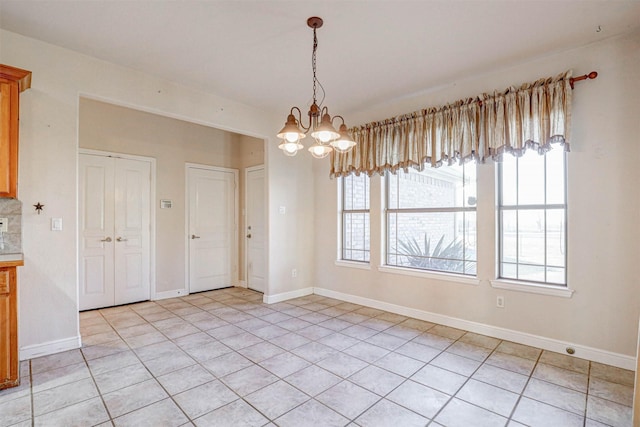 unfurnished dining area with a notable chandelier and light tile patterned flooring