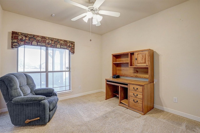 office area featuring light carpet and ceiling fan