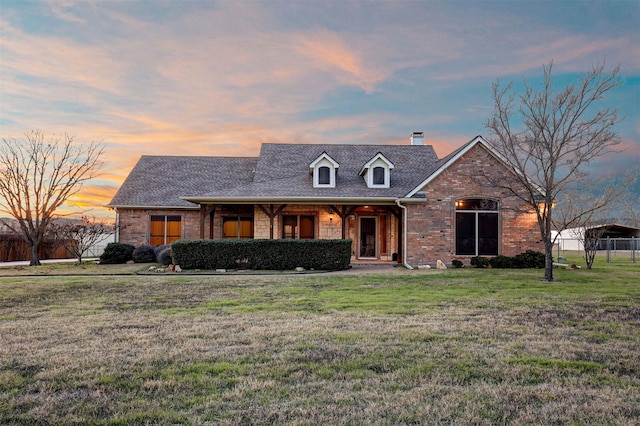 view of front of property with a yard