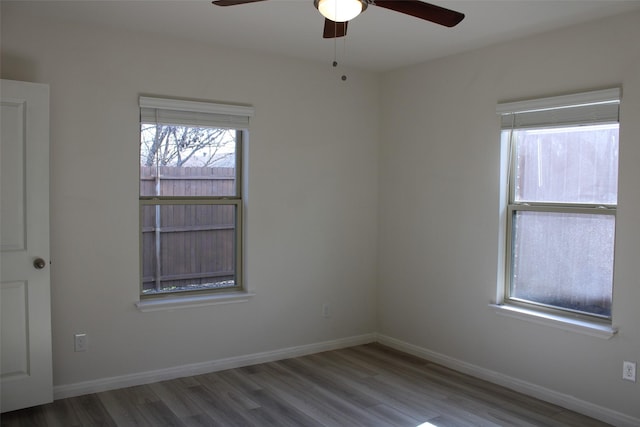 spare room featuring ceiling fan and hardwood / wood-style flooring