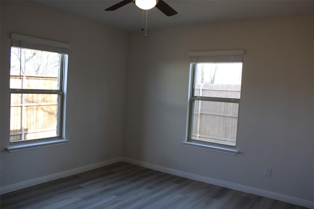 empty room featuring hardwood / wood-style flooring and ceiling fan