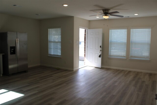 interior space with dark hardwood / wood-style floors and ceiling fan