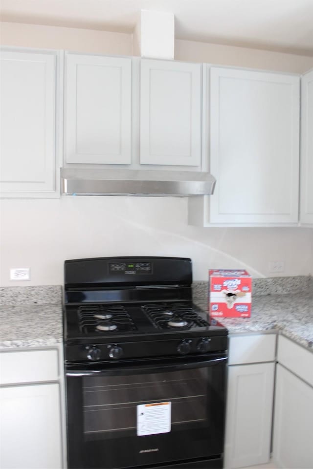 kitchen with white cabinets and black gas range