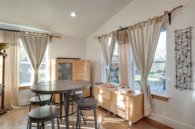 dining space with lofted ceiling