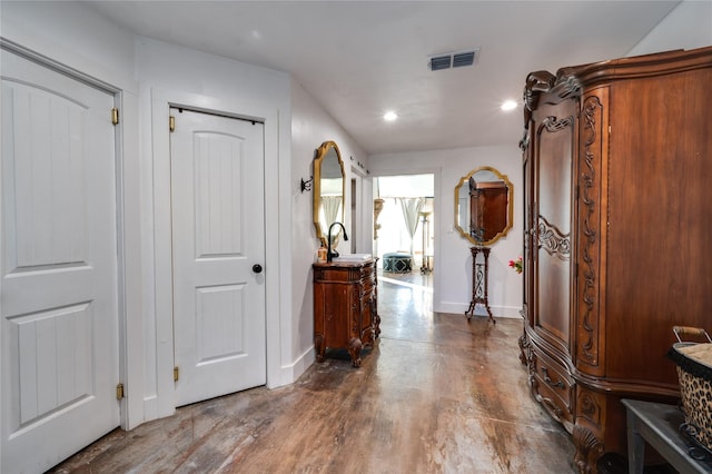 hall with dark wood-type flooring