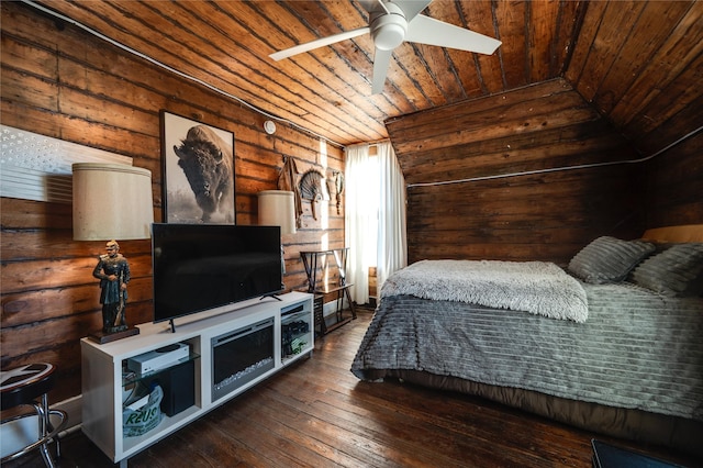 bedroom featuring dark hardwood / wood-style flooring, log walls, and wooden ceiling