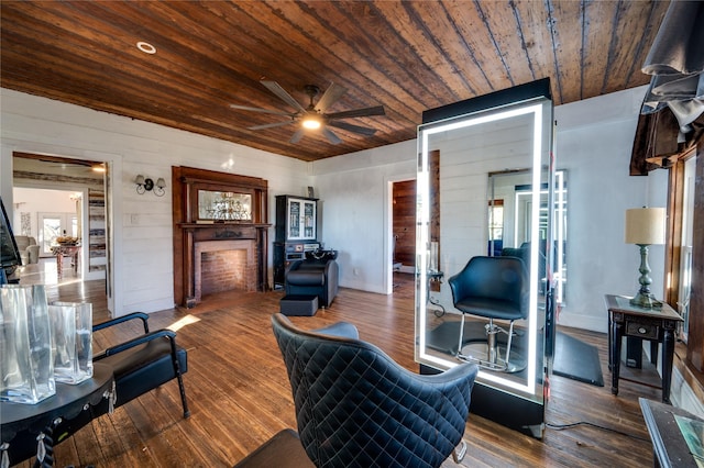 living room with hardwood / wood-style flooring, wooden ceiling, and ceiling fan