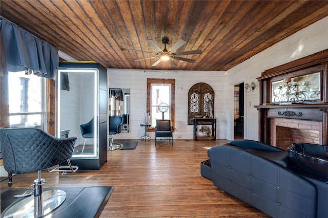 living room with hardwood / wood-style flooring, plenty of natural light, and wooden ceiling