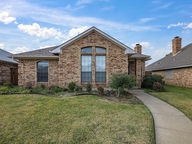 front facade with a front yard