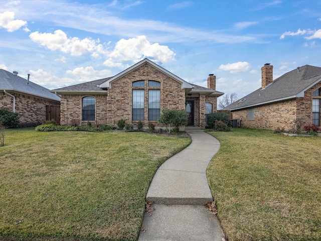 view of front of home featuring central AC and a front lawn