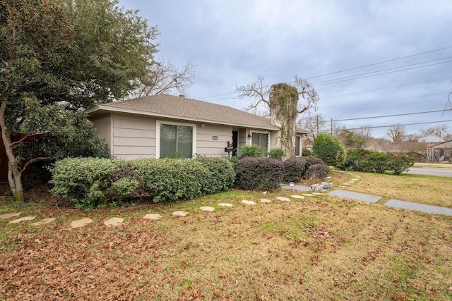 ranch-style house with a front yard