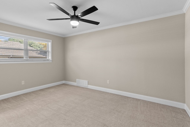 unfurnished room featuring ceiling fan, light colored carpet, and ornamental molding