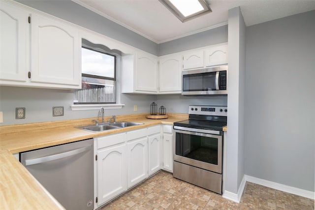 kitchen featuring sink, white cabinets, and stainless steel appliances