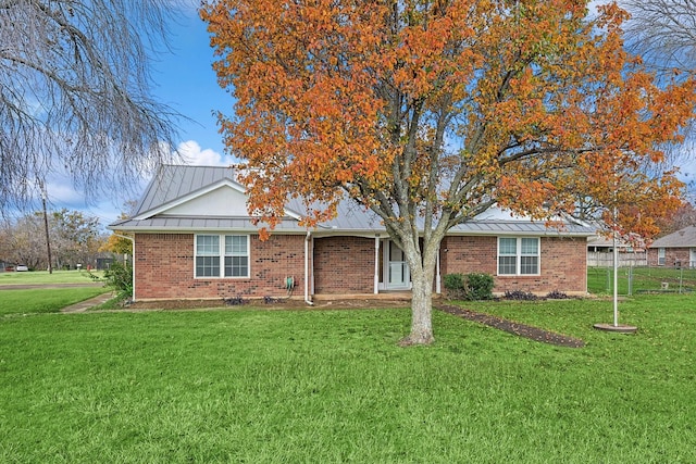 single story home with a front yard