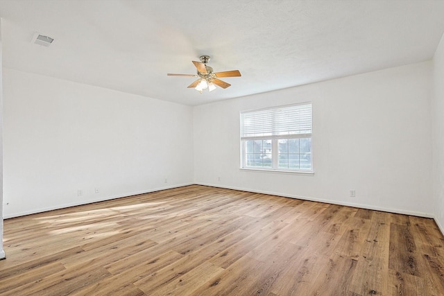 unfurnished room featuring ceiling fan and light wood-type flooring