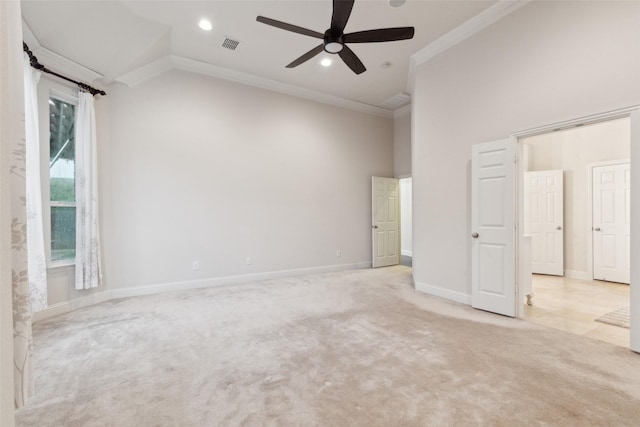 spare room with crown molding, ceiling fan, high vaulted ceiling, and light carpet