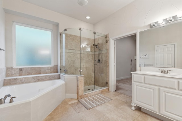 bathroom with vanity, tile patterned floors, and separate shower and tub