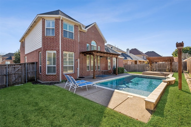 rear view of property featuring a fenced in pool, a patio, a lawn, and a pergola