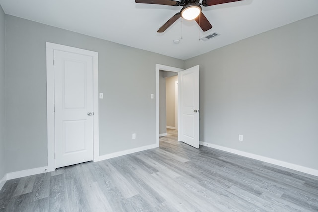 unfurnished bedroom featuring light hardwood / wood-style floors and ceiling fan