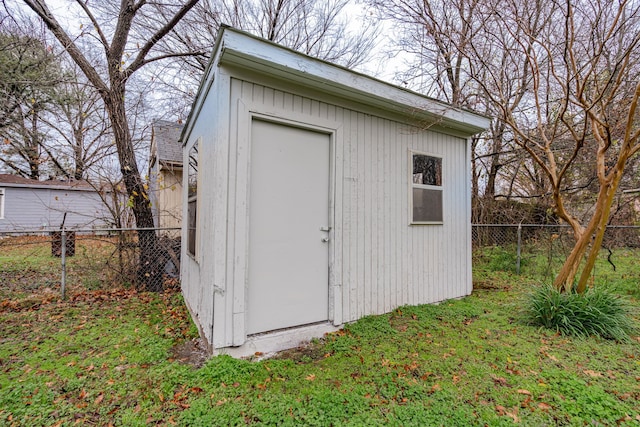 view of outdoor structure featuring a lawn