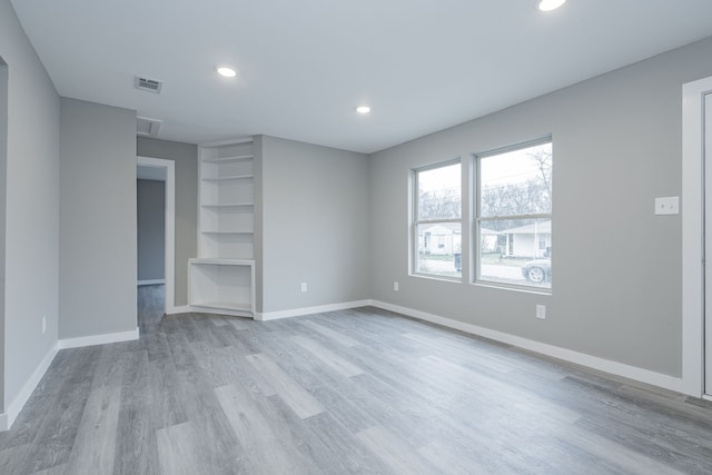 unfurnished bedroom with light wood-type flooring