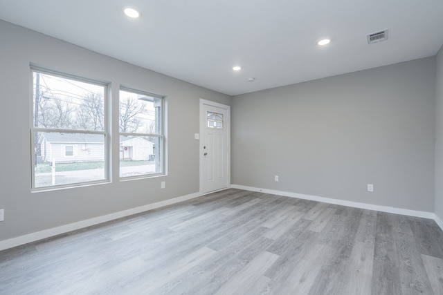 spare room featuring light hardwood / wood-style floors