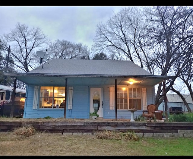 back of property featuring a porch