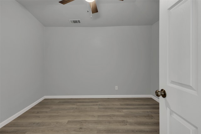 empty room with ceiling fan and wood-type flooring